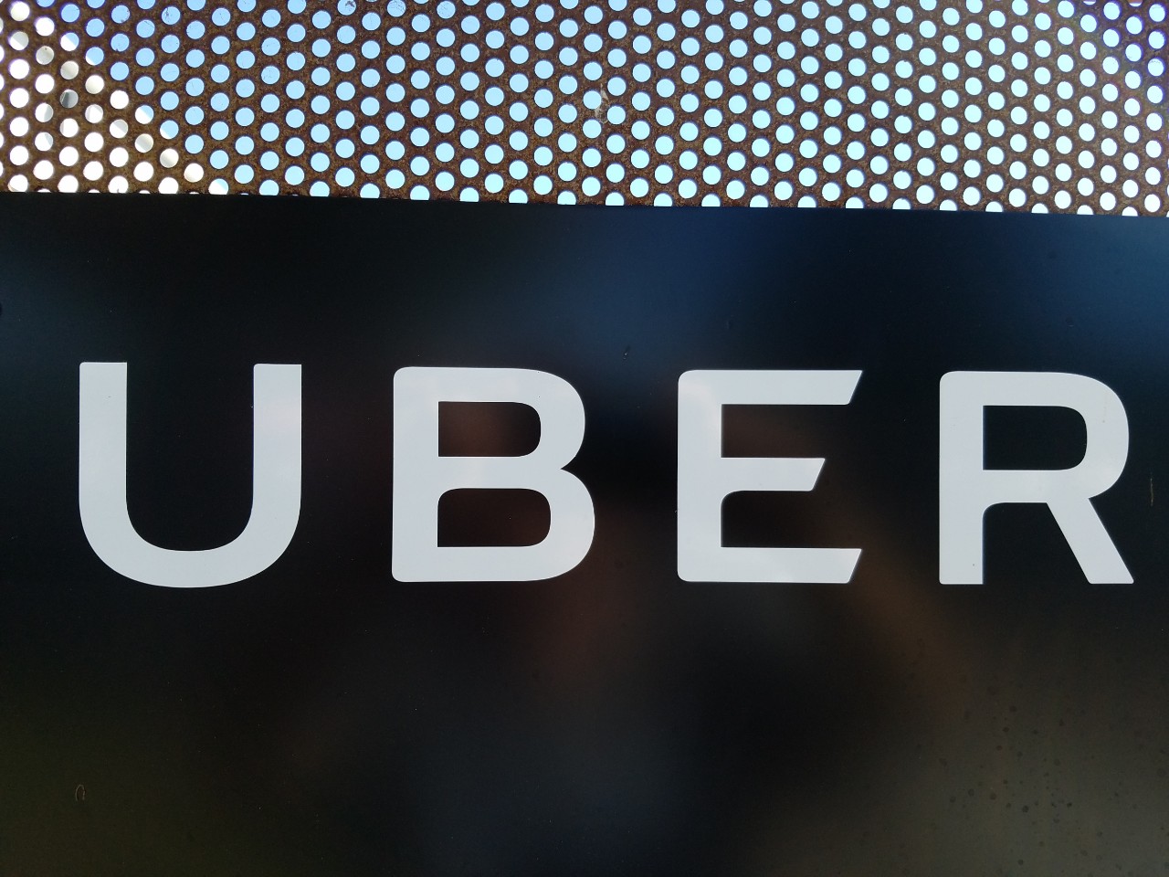 Close-up of logo at Greenlight Hub and inspection center for ridesharing company Uber Inc, a centralized location where new drivers' vehicles are inspected and cleared by the company, in the Silicon Valley, San Jose, California, September 18, 2018. (Photo by Smith Collection/Gado/Getty Images)