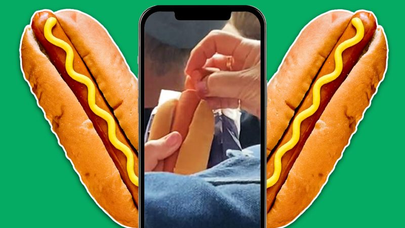 Internet horrified by Aussie Open fan's crook hotdog-eating technique